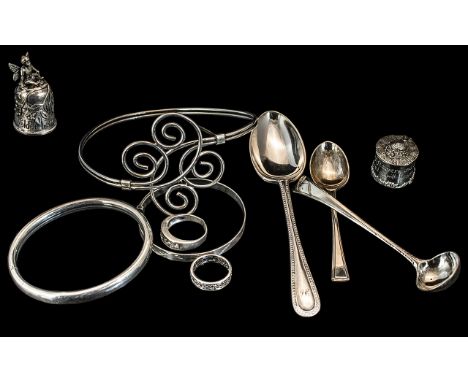 Small Collection of Silver Items, comprising a silver ring set with crystal stones, size O, marked 925, a silver scroll ring 