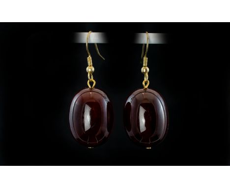Pair of Dark Cherry Amber Style Large Drop Earrings, large oval drops of the dark cherry shade of reconstituted amber, one of