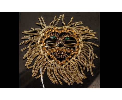 A Vintage Dominique Lion Brooch. Crafted in gold plated metal and crystals. An impressive lion figural brooch with a fabulous