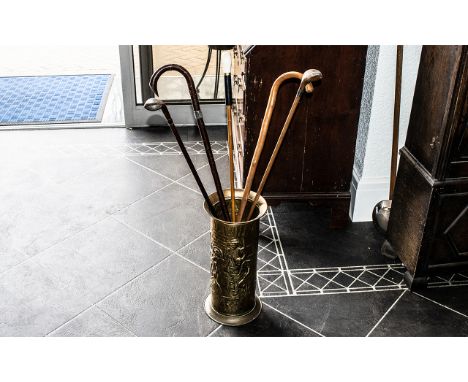 Brass Umbrella Stand 17" tall, with traditional pattern, together with five walking sticks, one by Fulton with a duck's head,