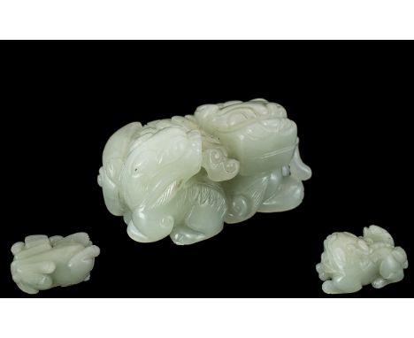 Chinese Late 19th / Early 20th Century Well Carved Jade Figure. Depicts a Large Foo-Dog with Young Beast, Reclining to Side. 