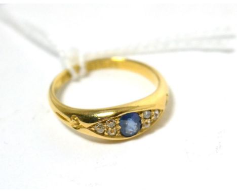 An 18ct gold sapphire and diamond ring