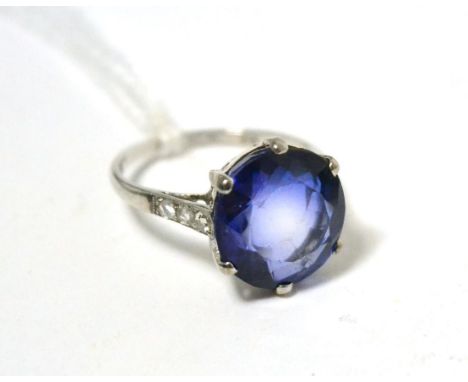 A synethetic sapphire and diamond ring 