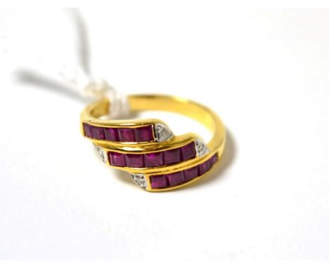 A ruby and diamond three row ring stamped '750'