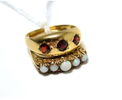 A 9ct gold garnet ring and an opal ring (2) 