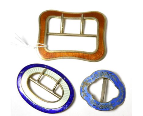 A silver and orange guilloche enamel buckle by Lawrence Emanuel and two other silver and enamel buckles (3)