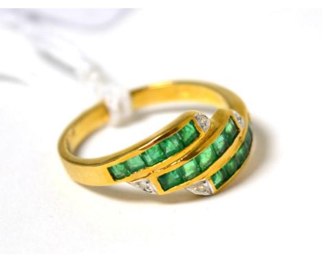 An emerald and diamond three row ring stamped 750