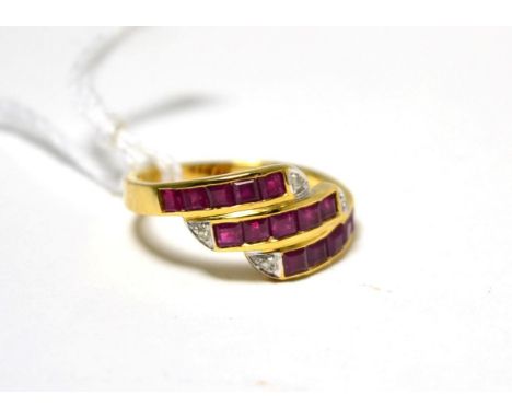 A ruby and diamond three row ring stamped '750'