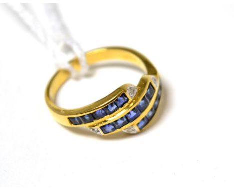A sapphire and diamond three row ring stamped '750'