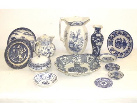 A late 19thC/Early 20thC Dutch Delftware fruit bowl, decorated with a basket of flowers; and other items of blue and white ce