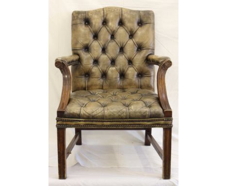 A modern brown leather button back armchair, Victorian style, 98cm high