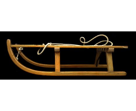 A vintage child's wooden sled, marked Davos Austria, 91cm max