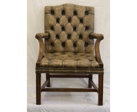 A modern brown leather button back armchair, Victorian style, 98cm high