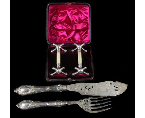 A pair of silver plated fish servers, the pierced blade decorated with foliate scrolls and a pair of fish; and a pair of silv