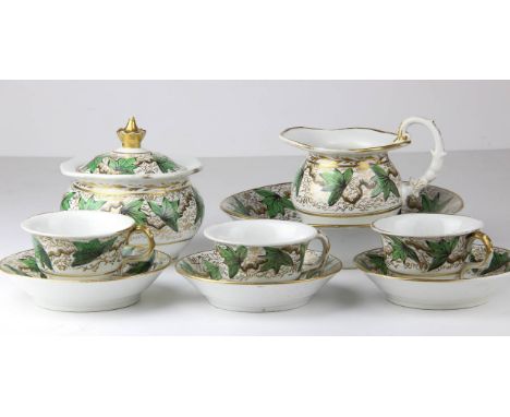 An English porcelain part service, c1820, painted with 'Napoleon Service' style ivy leaves, comprises milk, sugar bowl and co