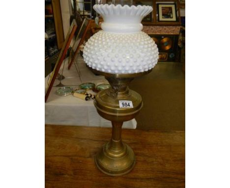 An early 20th century brass oil lamp complete with shade, COLLECT ONLY.