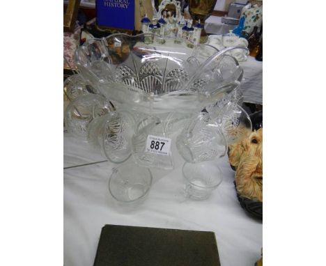 A large glass punch bowl with cups and a plastic ladle. COLLECT ONLY.