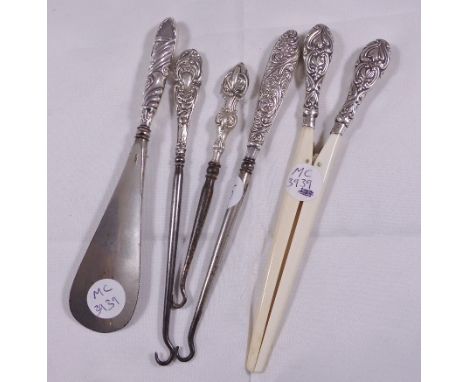 MIXED SILVER. Collectable items including three hallmarked silver topped button hooks, silver topped glove stretcher and shoe