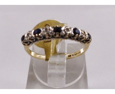9CT DIAMOND AND SAPPHIRE RING. 9ct gold diamond and sapphire eternity ring, size K