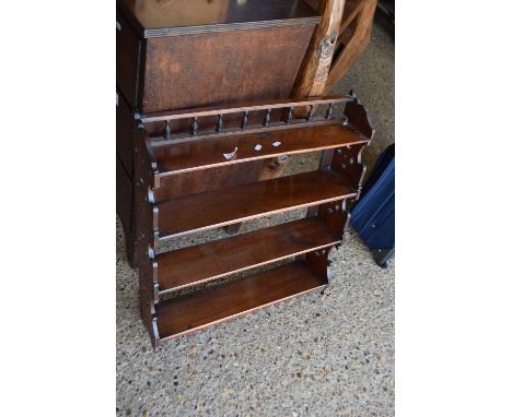 Small late Victorian mahogany four tier wall shelf with galleried back