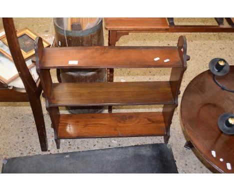 A three tier hardwood wall shelf
