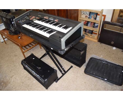 A Technic PCM sound C300 keyboard together with a Line 6 amplifier and assorted cables