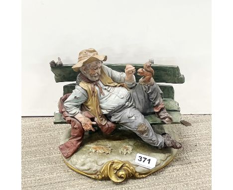 A signed D. Merli Capodimonte porcelain figure, W. 25cm.