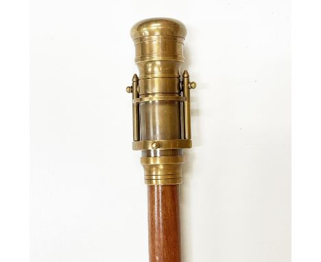 A telescope topped walking stick, L. 67cm.
