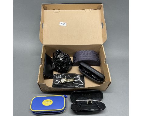A quantity of designer sunglasses and watches.