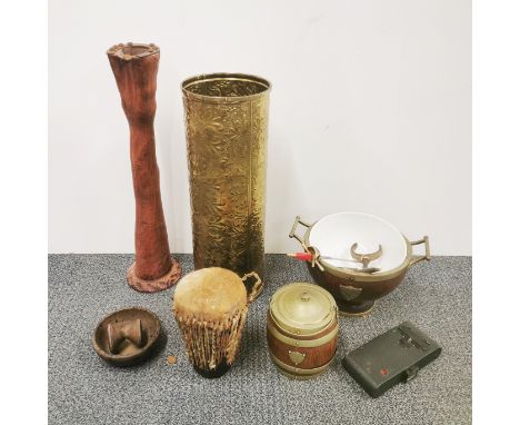 A brass umbrella stand and a group of other items.