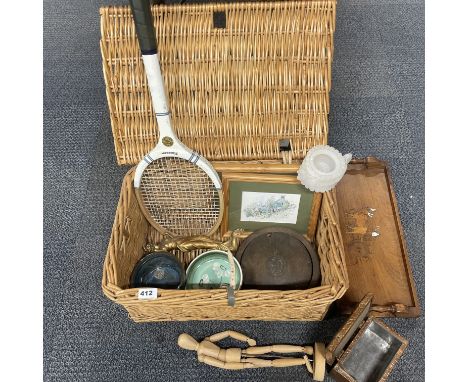 A picnic basket and interesting contents.