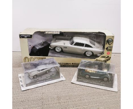 A boxed radio controlled James Bond 007 Skyfall DB5 together with two further boxed Bond models.