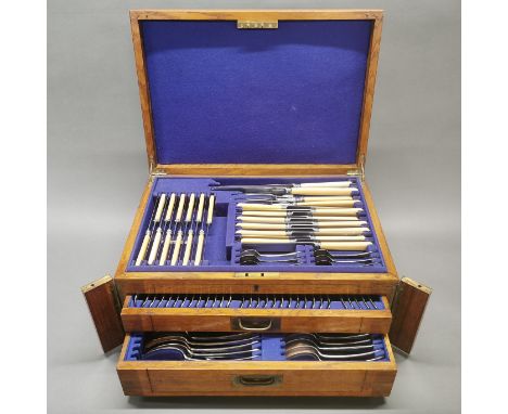 An oak cased silver plated cutlery set, approximately 102 pieces.