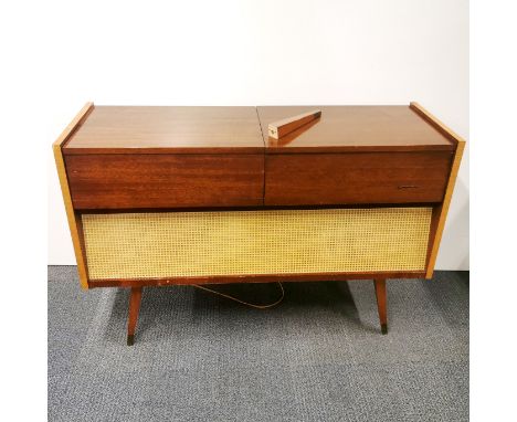 A vintage Grundig York radiogram 3026/GB with record player and mixed records, one leg A/F, 120 x 80 x 41cm.