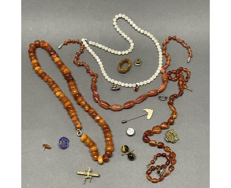A quantity of amber, mother of pearl and other beads etc.