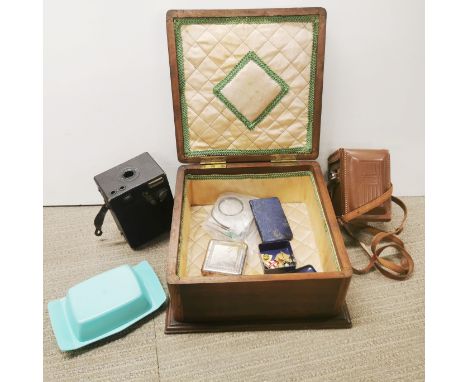 A mahogany work box with camera and other contents.