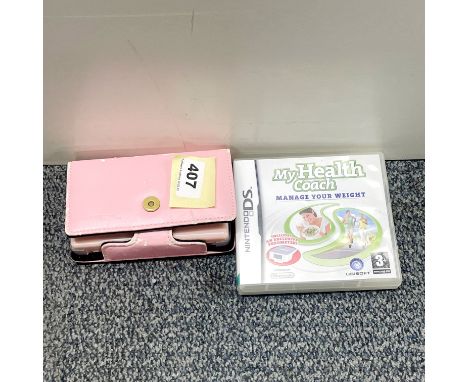A pink Nintendo DS with stylus, case and My Health Coach game.