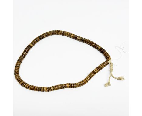 A single strand of Tibetan human skull prayer beads, L. 58cm.