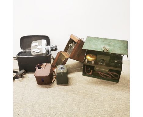 A vintage cine camera with a leather cased morse tapper, and a further tapper.
