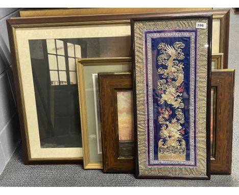 A framed Chinese embroidery with a group of mixed oil finished and other prints, largest 92cm x 67cm.