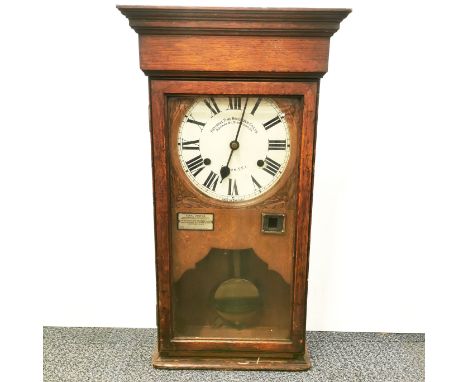 A National Time Recorder Co. Ltd oak cased wall clock, 73 x 40 x 20cm.