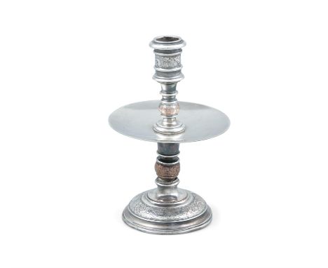 AN UNUSUAL SILVER PLATED CANDLESTICK, possibly Russian, with spool shaped nozzle and turned column, fitted with a disked drip
