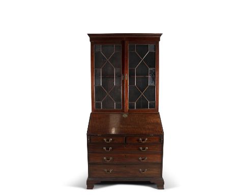 A COMPOSED GEORGE III STYLE MAHOGANY BUREAU BOOKCASE, with moulded dentil cornice above twin astragal glazed doors, raised ab