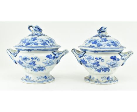 A pair of 19th century Victorian ironstone china blue and white lidded twin handled pots. Each pot decorated with finial tuli