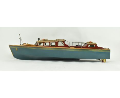 A mid 20th century hand made wooden model of the Royal Yacht Britannia. The ship featuring hand made details including life r