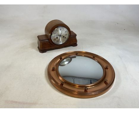 A twentieth century walnut cased mantle clock together with a reproduction convex metal mirror 42cm