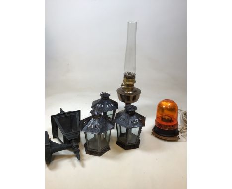 An Aladdin oil lamp No 23, height 61cm together with three tea light lanterns, an electric garden light and a flashing car li