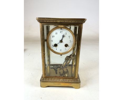Samuel Marti of Paris - An early 20th Century French antique four panel bevelled glass mantel clock. White enamel face with R