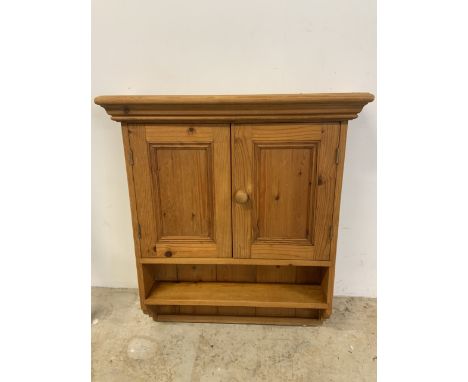 A small pine wall cupboard with interior and lower shelf. W:70cm x H:82cm