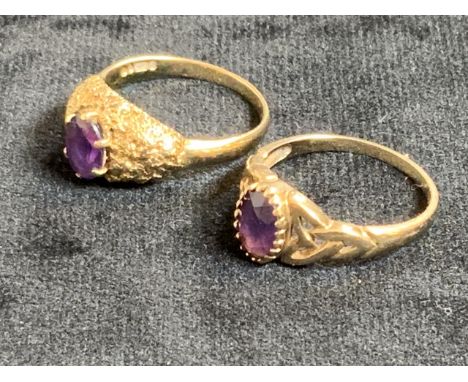 Two gold rings with amethyst stones, hall marks worn. Size Q.